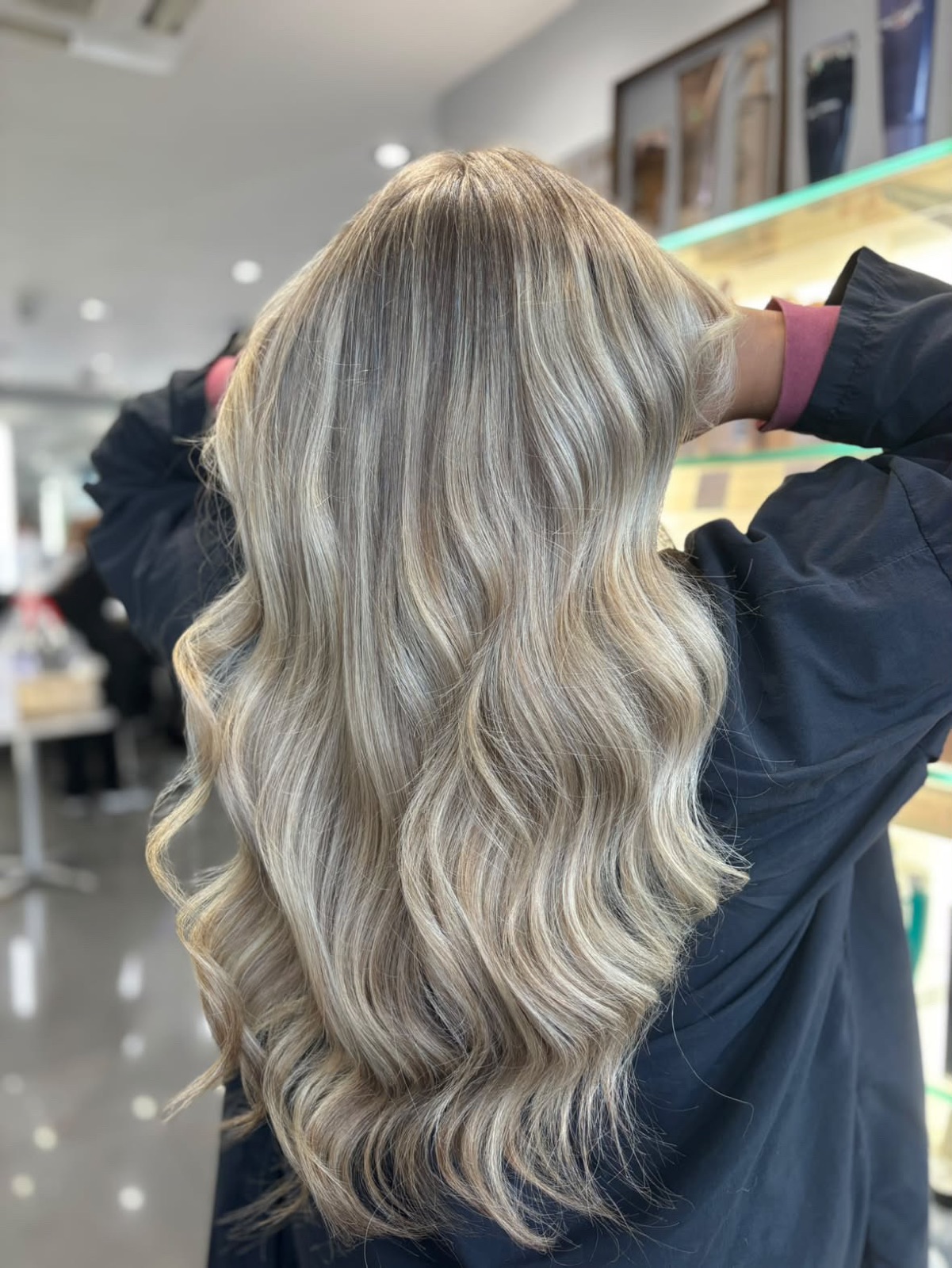 After: cool, blended ash blonde with soft waves