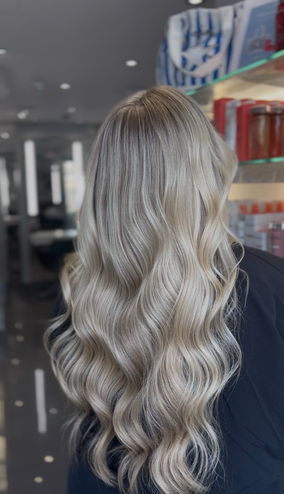 Icy dimensional blonde with a soft shadow root and waves
