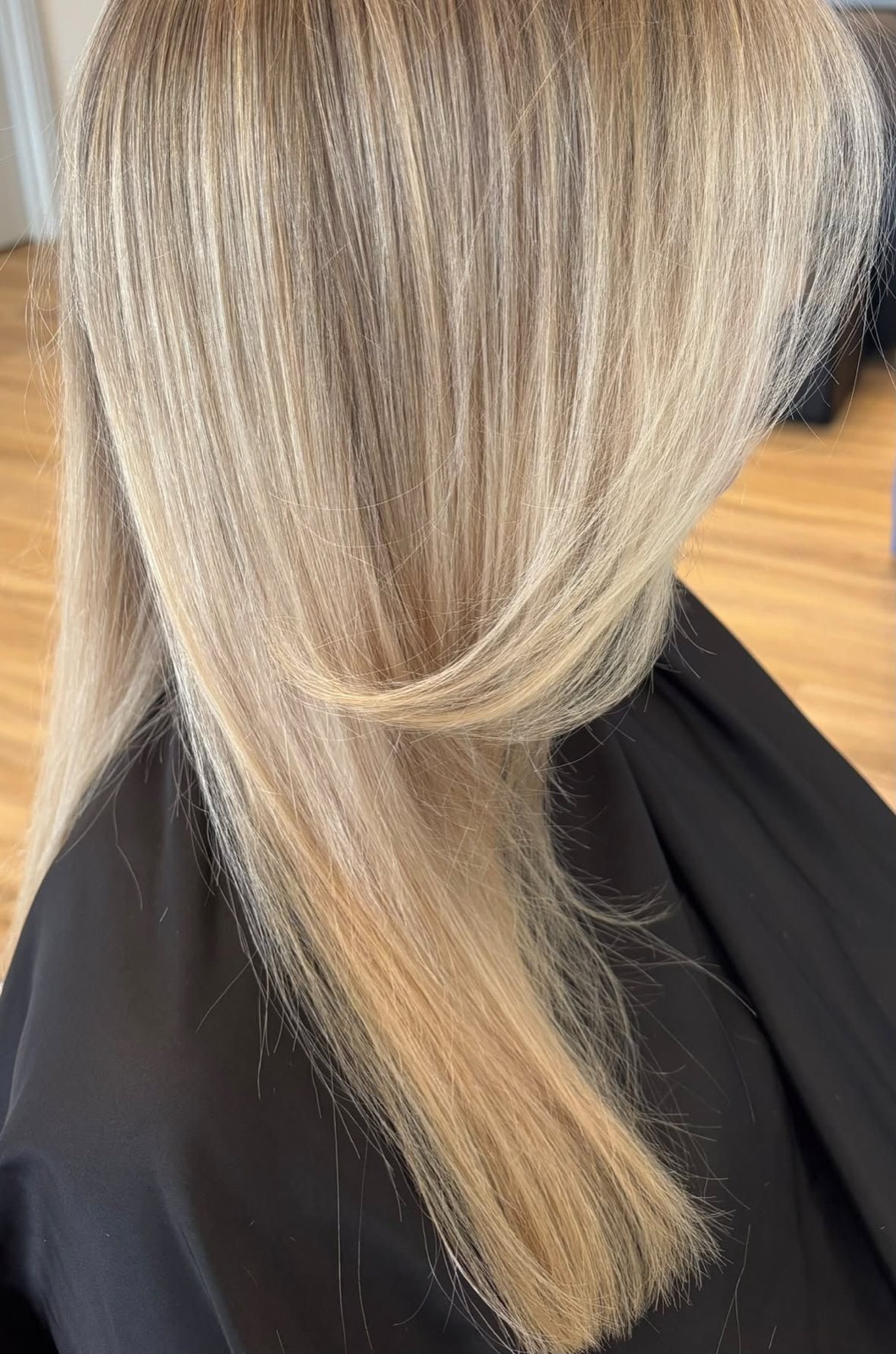 Sleek, straight blow-dry showing blended blonde highlights